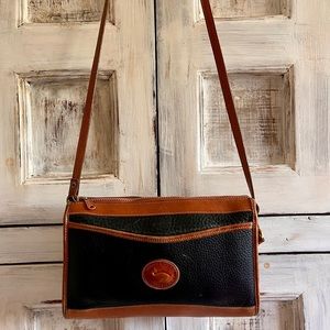 Dooney & Bourke vintage leather bag. 10 inch wide/7 high/2 3/4 deep. Black/ tan
